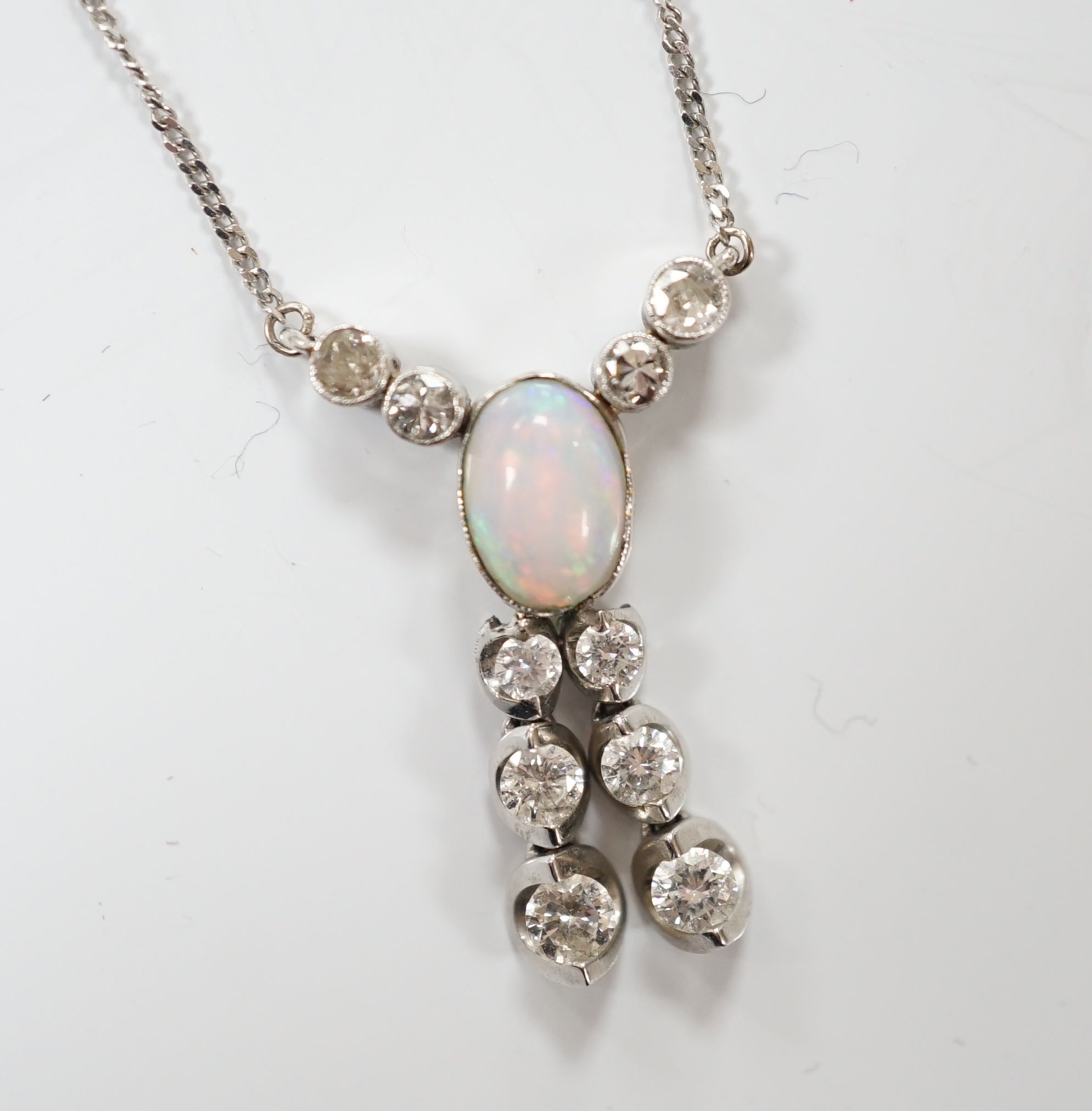 A modern 18ct white gold, white opal and diamond cluster set double drop pendant necklace, overall 56cm, gross weight 4.1 grams.